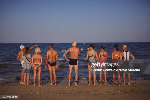 Athletes chill out at the beach the day before the Ironman Emilia Romagna on September 21, 2018 in Cervia, Italy.