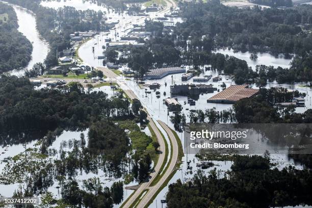 Road partially covered by floodwater is seen in this aerial photograph taken above Kinston, North Carolina, U.S., on Friday, Sept. 21, 2018. Record...