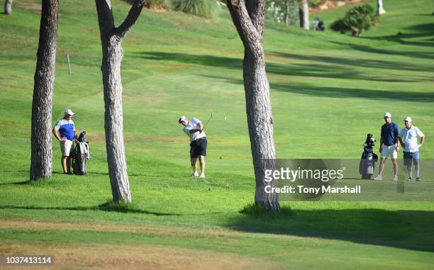 Garry Houston of Carden Park Golf Resort plays his second shot on the 1st fairway during Day Two of The Lombard Trophy Grand Final on September 21,...