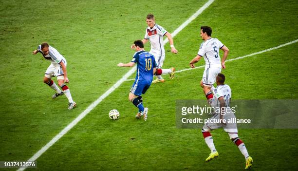 Germany's Benedikt Hoewedes , Jerome Boateng Bastian Schweinsteiger and Mats Hummels vie for the ball with Argentina's Lionel Messi during the FIFA...
