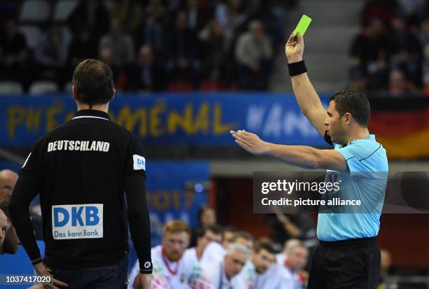 Germany's coach Dagur Sigurdsson is yellow-carded during the men's Handball World Cup match between Belarus and Germany in Rouen, France, 18 January...