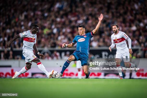 Alfredo Morales of Duesseldorf and Chadrac Akolo of Stuttgart in action during the Bundesliga match between VfB Stuttgart and Fortuna Duesseldorf at...