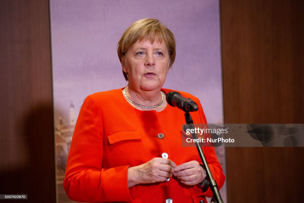 Angela Merkel giving a statement in Munich