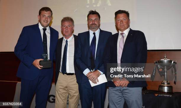 Ian Issac , MD of Lombard and Paul Robinson of Coca Cola pose with the third place team in The Lombard Trophy Grand Final Jason Partridge and Louis...