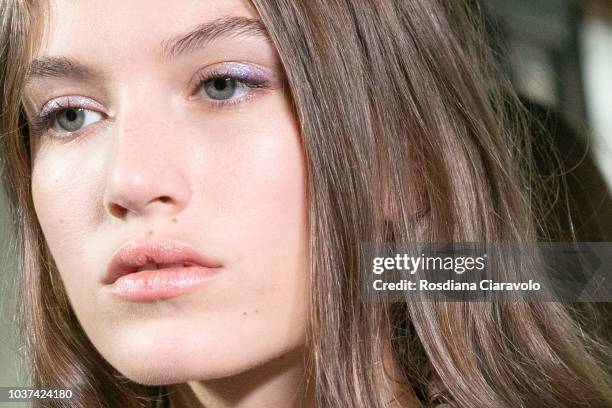 Model Altyn Simpson, make up detail, is seen backstage ahead of the Blumarine show during Milan Fashion Week Spring/Summer 2019 on September 21, 2018...