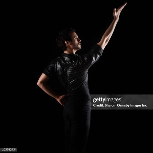 mixed race flamenco dancer - mixed race man standing studio stockfoto's en -beelden