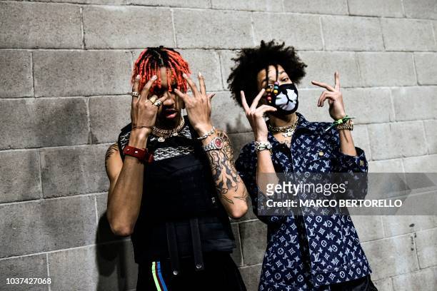 Hip hop dancers, Ayleo Bowles and Mateo Bowles, commonly known as Ayo & Teo, pose in the backstage priro to the presentation of the Philipp Plein...