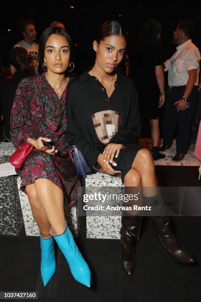 Tina Kunakey and guest arrive at the Marco De Vincenzo show during Milan Fashion Week Spring/Summer 2019 on September 21, 2018 in Milan, Italy.