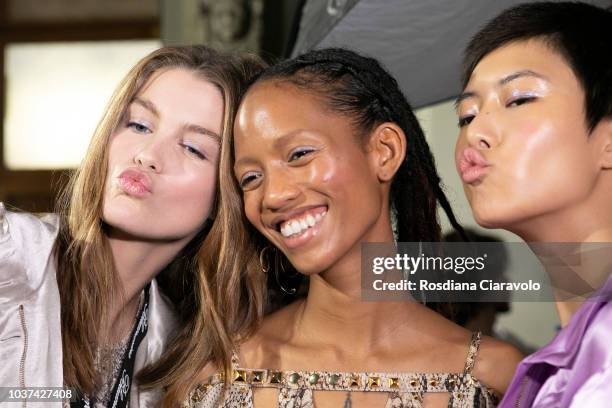Luna Bijl, Adesuwa Aighewi and Sohyun Jung are seen backstage ahead of the Blumarine show during Milan Fashion Week Spring/Summer 2019 on September...