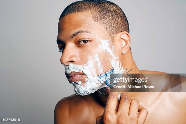 young african american male shaving - rasur stock-fotos und bilder