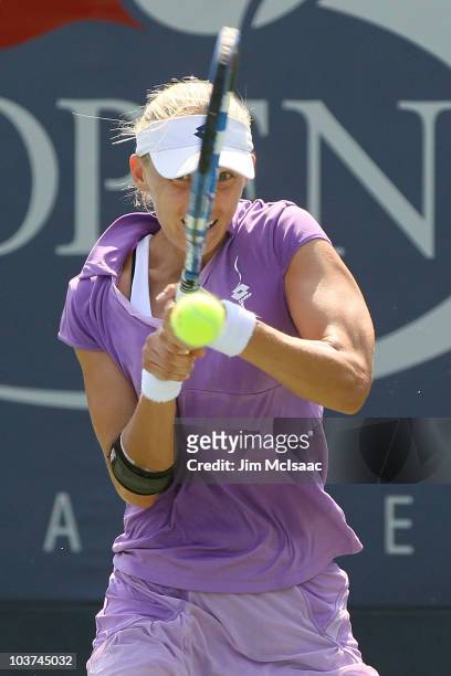 Mirjana Lucic of Croatia hits a return against Alicia Molik of Australia during her first round women's singles match on day two of the 2010 U.S....