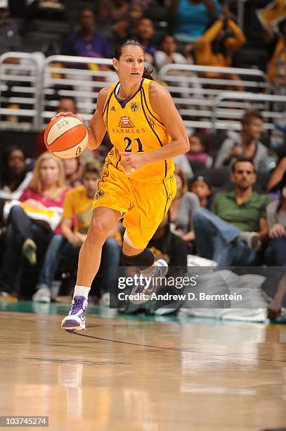 Ticha Penicheiro of the Los Angeles Sparks dribbles up court against the Seattle Storm during Game Two of the Western Conference Semifinals during...