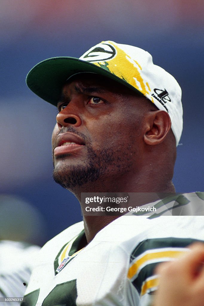 Defensive lineman Reggie White of the Green Bay Packers looks on from