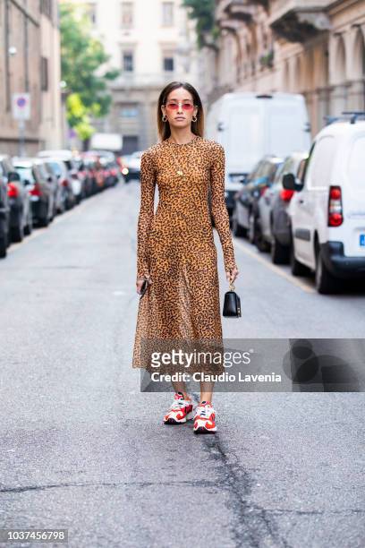 Guest, wearing animalier dress and Adidas sneakers, is seen before the Blumarine show during Milan Fashion Week Spring/Summer 2019 on September 21,...