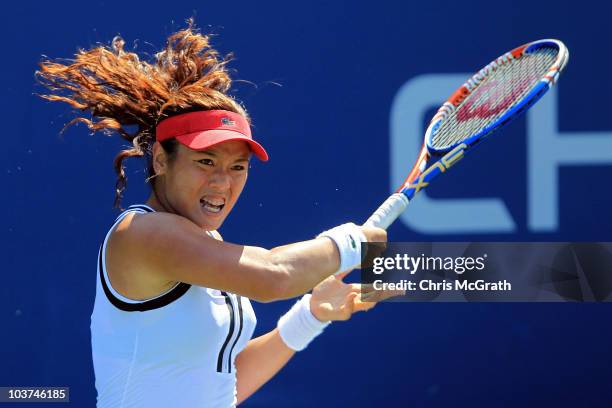 Yung-Jan Chan of Chinese Taipei returns a shot against Anne Keothavong of Great Britain during her women's singles first round match on day two of...