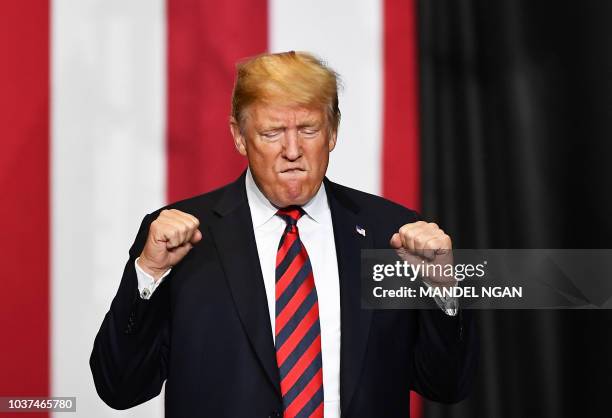 President Donald Trump arrives on stage to speak at a rally at JQH Arena in Springfield, Missouri on September 21, 2018.