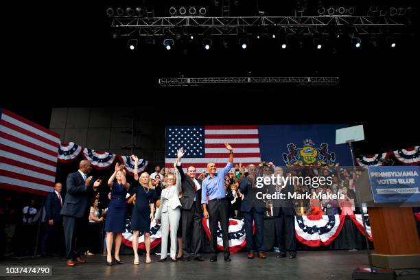 Former President Barack Obama joins Senator Bob Casey , Pennsylvania Governor Tom Wolf and other local Democratic candidates on stage at the end of a...