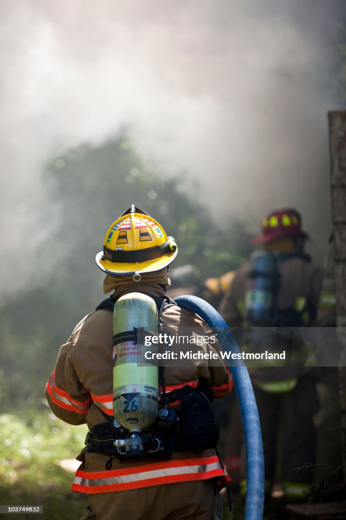 Firefighters Working Together to Contain Fire