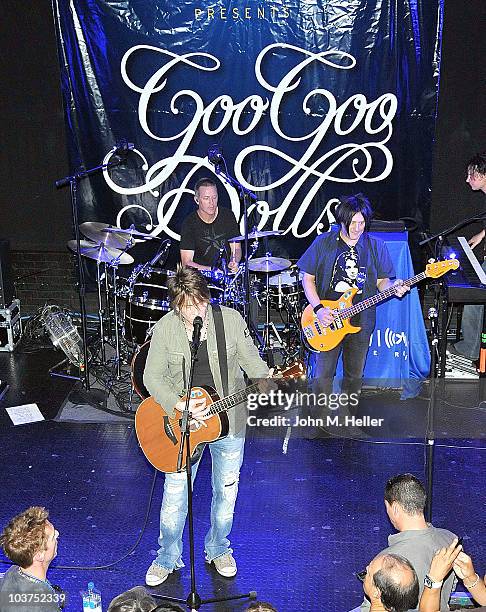 The Goo Goo Dolls drummer Mike Malinin, keyboardist Korel Tunador, lead vocalist John Rzeznik and bass guitarist Robby Takac perform as part of...