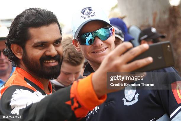 Steve Smith poses for photos with fans during the NSW First Grade Club Cricket match between Sutherland and Mosman at Glenn McGrath Oval on September...