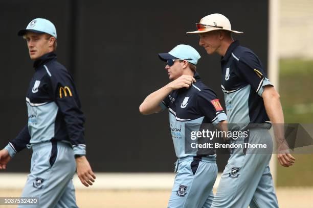 Steve Smith runs out to field with team mates during the NSW First Grade Club Cricket match between Sutherland and Mosman at Glenn McGrath Oval on...