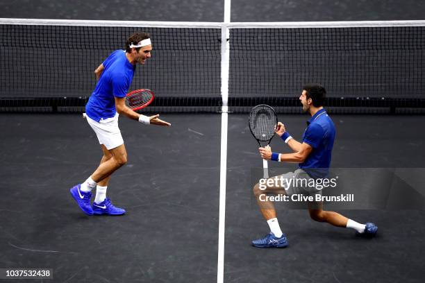 Team Europe Roger Federer of Switzerland and Team Europe Novak Djokovic of Serbia celebrate a point against Team World Jack Sock of the United States...