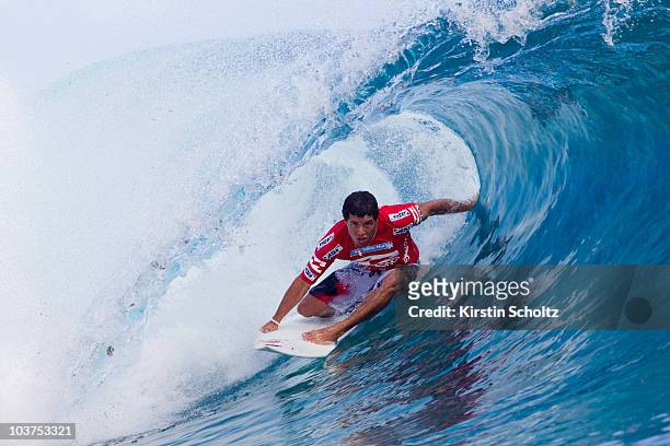 Adriano De Souza of Brazil surfs during round three of the Billabong Pro on August 31, 2010 in Teahupo'o, French Polynesia.