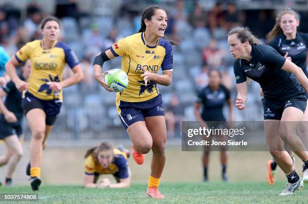 Trinity Mamoe of Bond University runs with the ball during the Aon Uni 7s match between Bond University and Adelaide University on September 22, 2018...