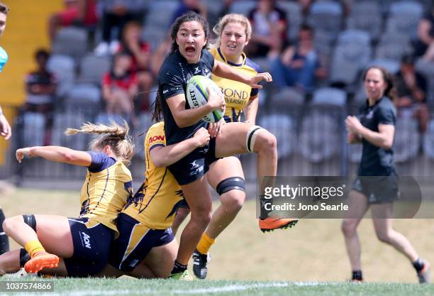 Olivia Bernadel-Huey of University of Adelaide runs with the ball during the Aon Uni 7s match between Bond University and Adelaide University on...