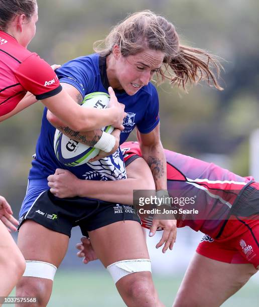 Ryan Carlyle of Melbourne University is tackled during the Aon Uni 7s match between University of Melbourne and Griffith University on September 22,...
