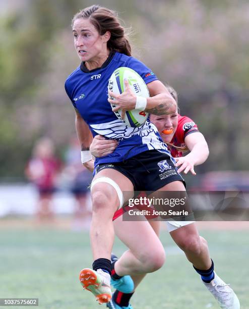 Ryan Carlyle of Melbourne University is tackled during the Aon Uni 7s match between University of Melbourne and Griffith University on September 22,...