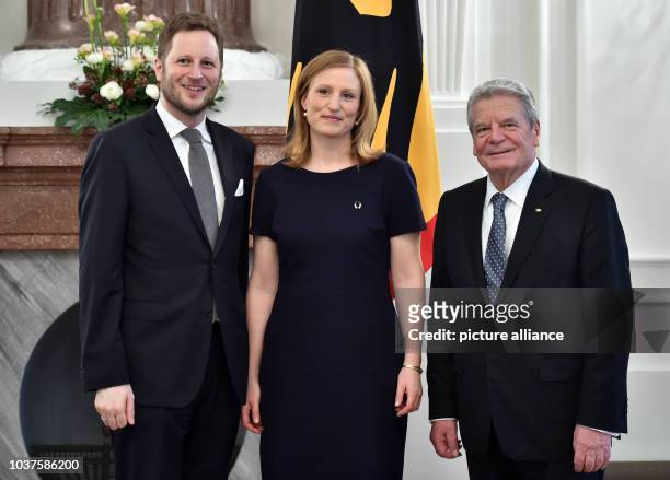 Georg Friedrich, Prince of Prussia and his wife, Sophie, Princess of Prussia, stand with German President Joachim Gauck during the awarding of the...