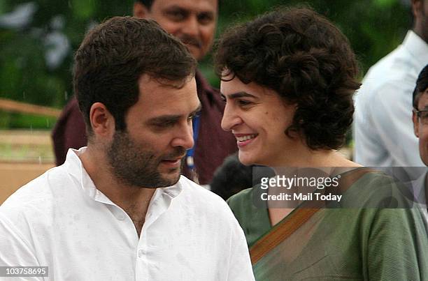 Congress General Secretary Rahul Gandhi and Priyanka Gandhi during the distribution of motorized tri-wheelers to disabled persons on the occasion of...
