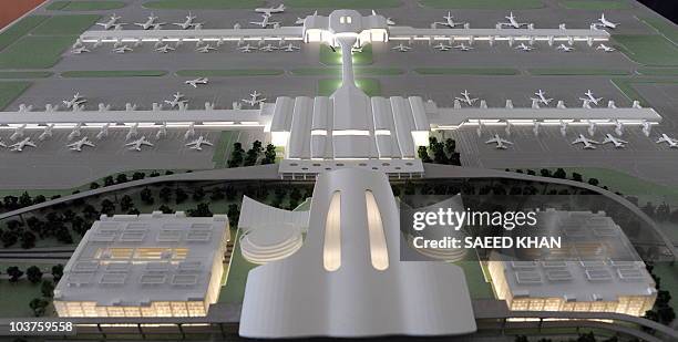 Model of a new low-cost terminal is display during the ground-breaking ceremony at Kuala Lumpur's international airport in Sepang by the Malaysian...