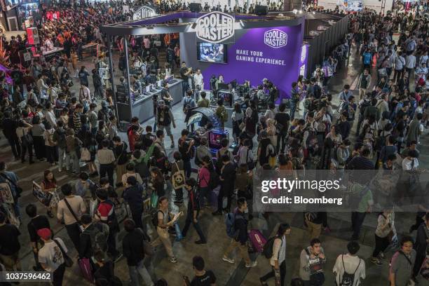 Attendees walk past the Cooler Master Co. Booth during the Tokyo Game Show in Chiba, Japan, on Saturday, Sept. 22, 2018. The show runs through to...