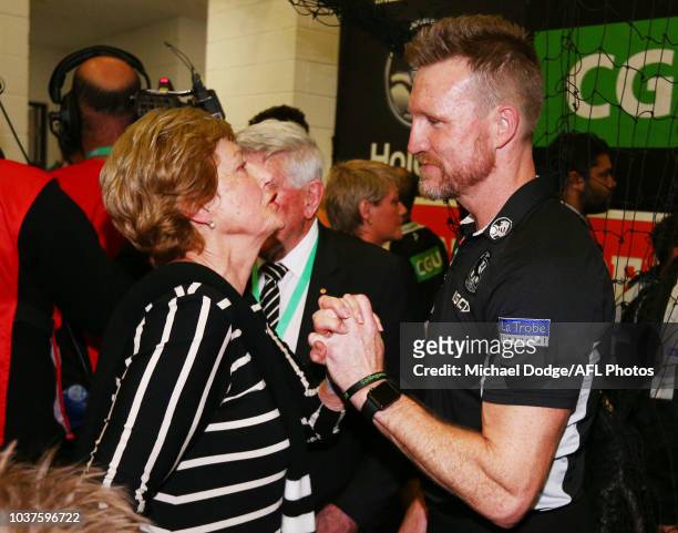 Magpies head coach Nathan Buckley celebrates the win with his mum during the AFL Preliminary Final match between the Richmond Tigers and the...