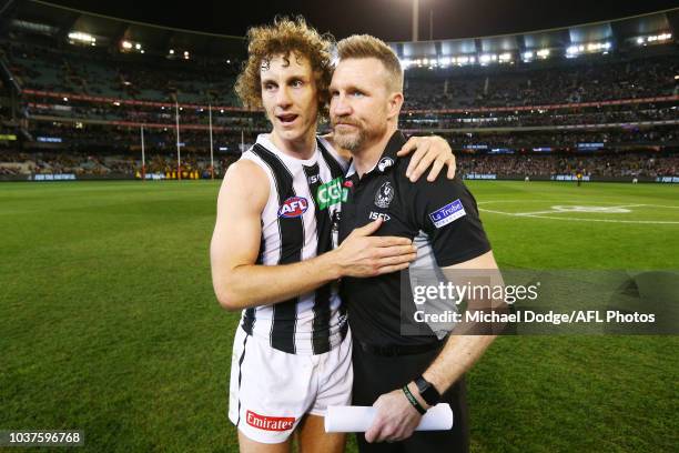 Magpies head coach Nathan Buckley celebrates the win with Chris Mayne of the Magpies during the AFL Preliminary Final match between the Richmond...