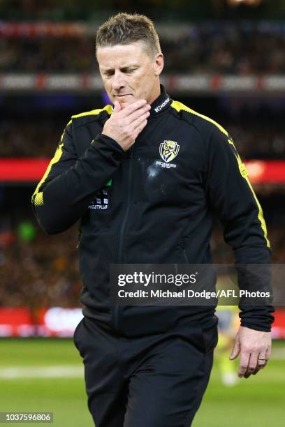 Tigers head coach Damien Hardwick walks off during the AFL Preliminary Final match between the Richmond Tigers and the Collingwood Magpies on...