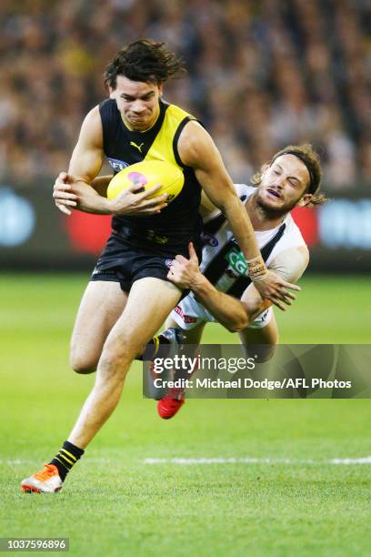 James Aish of the Magpies tackles Daniel Rioli of the Tigers during the AFL Preliminary Final match between the Richmond Tigers and the Collingwood...