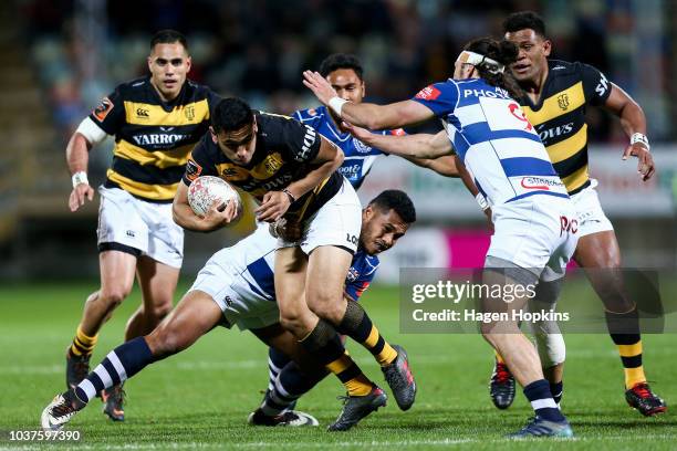 Stephen Perofeta of Taranaki is tackled during the round six Mitre 10 Cup match between Taranaki and Auckland at Yarrow Stadium on September 22, 2018...