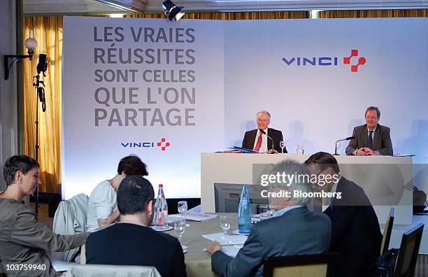 Xavier Huillard, chief executive officer of Vinci SA, left, and Christian Labeyrie, chief financial officer of Vinci SA, hold a news conference in...