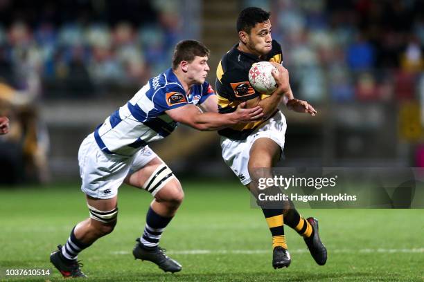 Stephen Perofeta of Taranaki is tackled by Dalton Papalii of Auckland during the round six Mitre 10 Cup match between Taranaki and Auckland at Yarrow...