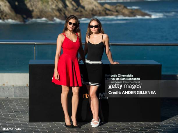 French actresses Laetitia Casta and Lily-Rose Depp pose during a photocall to promote their film "L'Homme Fidele" during the 66th San Sebastian Film...