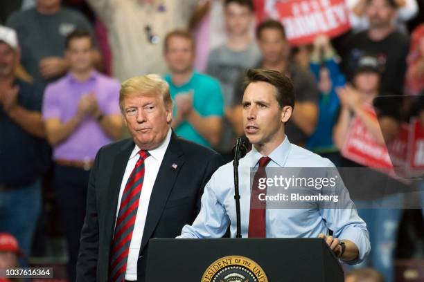 Josh Hawley, Republican senate candidate for Missouri, right, speaks as U.S. President Donald Trump looks on during a rally in Springfield, Missouri,...