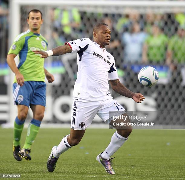 Collins John of the Chicago Fire controls the ball against Patrick Ianni of the Seattle Sounders FC on August 28, 2010 at Qwest Field in Seattle,...