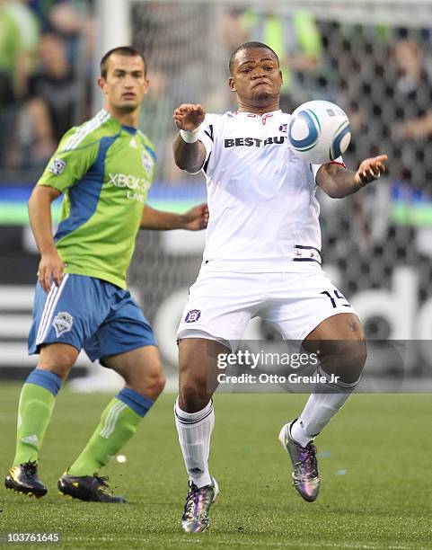 Collins John of the Chicago Fire controls the ball against Patrick Ianni of the Seattle Sounders FC on August 28, 2010 at Qwest Field in Seattle,...