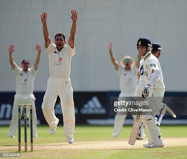 Azhar Mahmood of Kent celebrates dismissing Laurie Evans of Warwickshire during the LV County Championship match between Warwickshire and Kent at...