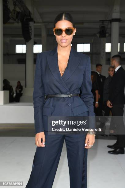 Tina Kunakey attends the Roberto Cavalli show during Milan Fashion Week Spring/Summer 2019 on September 22, 2018 in Milan, Italy.