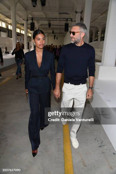 Tina Kunakey and Vincent Cassel attend the Roberto Cavalli show during Milan Fashion Week Spring/Summer 2019 on September 22, 2018 in Milan, Italy.