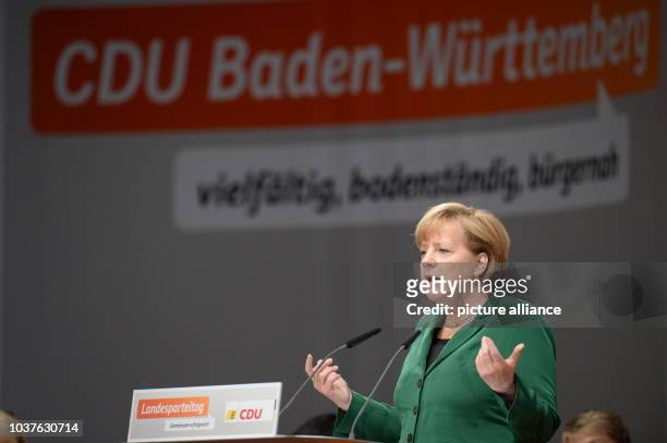 German Chancellor Angela Merkel talks at an election campaign event for the 2013 German federal elections in Heilbronn, Germany, 14 September 2013....